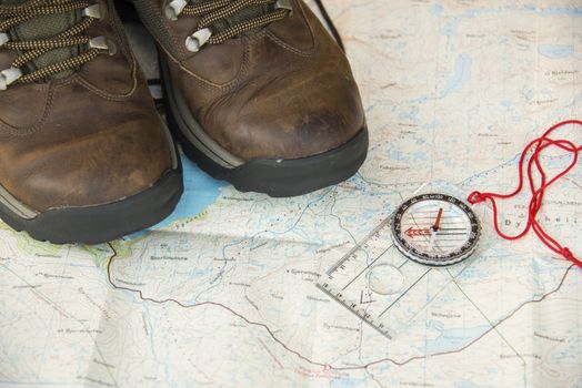 A pair of old hiking boots on a map over central Europe