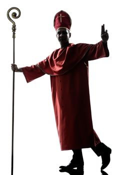 one man cardinal bishop silhouette saluting blessing in studio isolated on white background