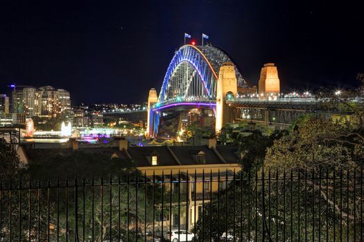 SYDNEY, NSW, AUSTRALIA - JUNE 3, 2014;  Sydney Harbour Bridge during Vivid Sydney from Observatory Hill.  View North across the harbour to North Sydney.  Long  exposure 