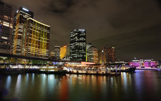SYDNEY NSW, AUSTRALIA - JUNE 3  2014; Sydney City and Circular Quay lit up in vibrant colour during annual Vivid Festival