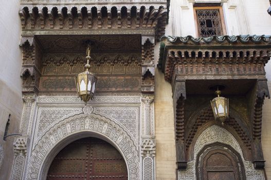 Ornate entrance to the historic Kairaouin Mosque deep inside the medina of Fes in Morocco.
