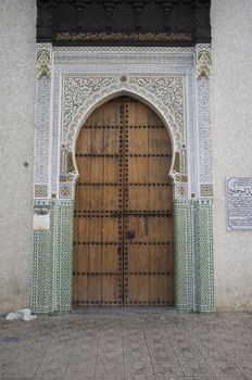 Traditional islamic keyhole shaped door in the historic medina in the ancient city of Fes in Morocco