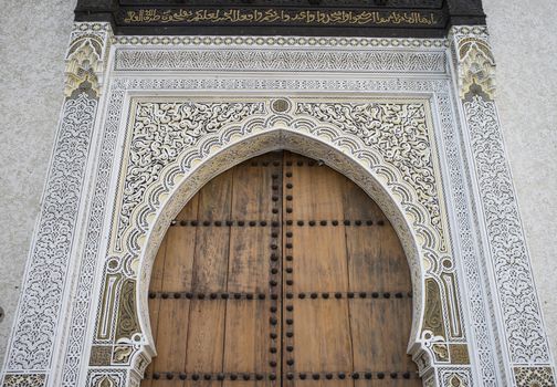 Traditional islamic keyhole shaped door in the historic medina in the ancient city of Fes in Morocco