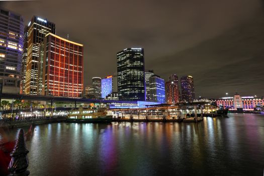 SYDNEY, AUSTRALIA - JUNE 3, 2014;  Circular Quay and Sydney City CBD buildings in vibrant colour during the annual Vivid Sydney Event in Australia