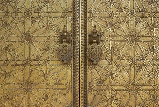 Detail of the ornate doors and door knockers at the Royal Palace in Fes, Morocco