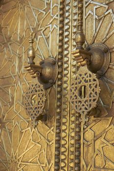 Detail of the ornate door knockers at the Royal Palace in Fes, Morocco