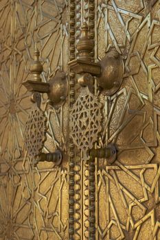 Detail of the ornate door knockers at the Royal Palace in Fes, Morocco