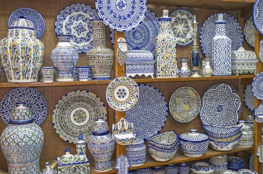 Traditional blue and white pottery for sale in a shop in the historic medina of Fes in Morocco