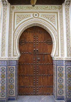 Old door in the historic medina in the ancient city of Fes in Morocco
