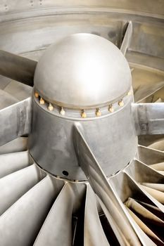 closeup of the blades of a jet engine turbine