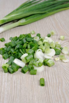 A handful of chopped green onions on the table