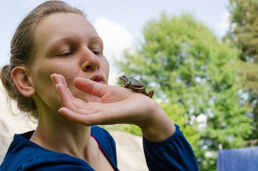 cinderella kissing little nice frog on palm