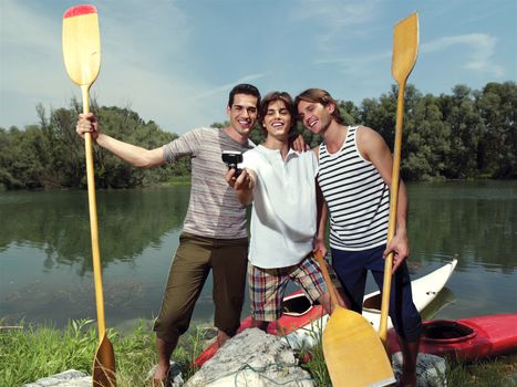 men with canoe in nature