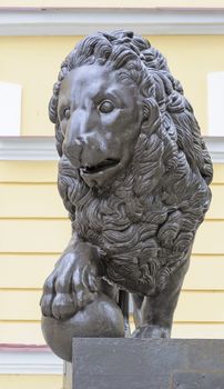 Bronze sculpture of lion with ball near the Novgorod State Museum, Russia