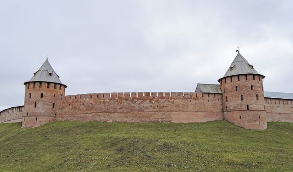 Fortification wall with two towers in Veliky Novgorod (Detinets), Russia