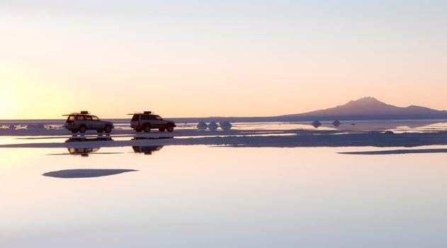 SALAR DE UYUNI, BOLIVIA - JULY 24: The car on the salt lake of Uyuni, July 24, 2011. Salar de Uyuni is located at an altitude of 4000 meters above sea level on the Altiplano plateau 