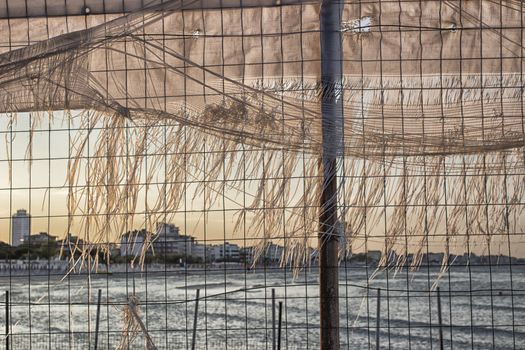 Bay of of Cervia in Northern Italy on the Adriatic Sea through an iron grid