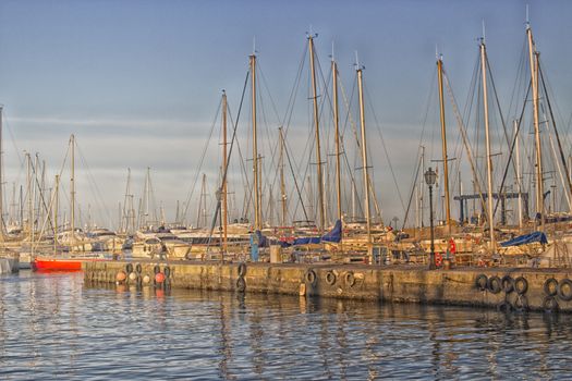 Sailing and engine boats moored in the harbour channel of Cervia in Northern Italy on the Adriatic Sea