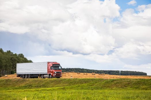 Trucks delivery cargo on the country road