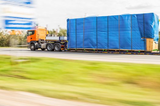 Truck delivery oversized cargo on the road
