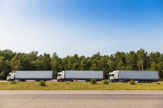 Trucks delivery cargoes on the road
