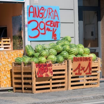 watermelons for sale from a greengrocer
