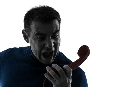 one caucasian angry man on the phone portrait in silhouette studio isolated on white background