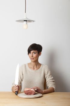 woman and a knife on a table
