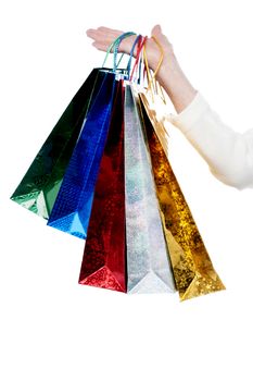 Woman hand with colorful shopping bags