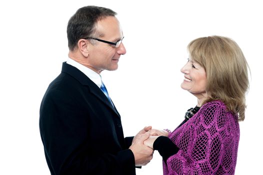 Senior couple in love holding hands