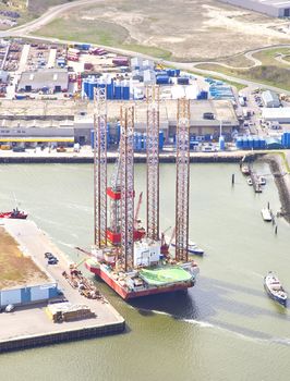 IJMUIDEN, THE NETHERLANDS - APRIL 15: Aerial view on offshore island in harbour of IJmuiden, The Netherlands at April 15 2014. Offshore islands are essential in gaining oil and gas for worldwide usage