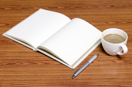coffee and notebook on wood background concept coffee time