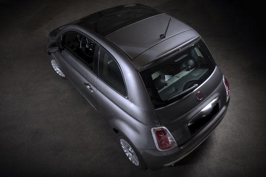 Rear Top View of Two Door Vehicle on dark background.