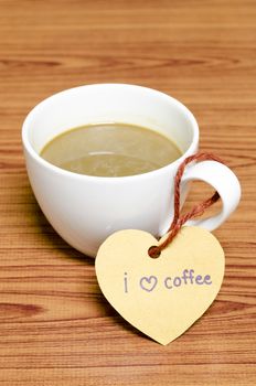 coffee cup with heart tag write I love coffee word on wood background