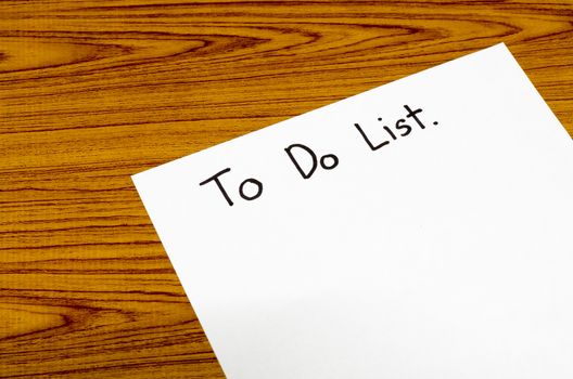 paper write to do list word on wood background