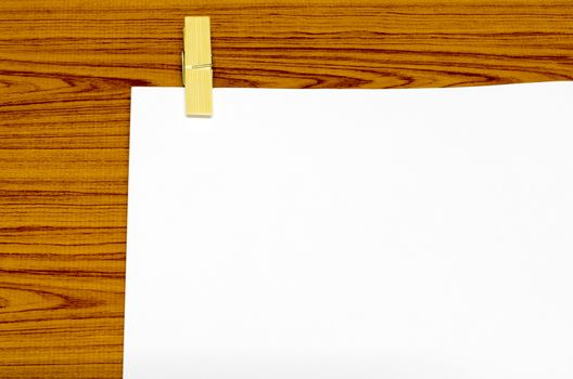wooden pin paper on wood background