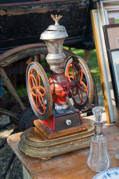 Vintage old antique manual coffee grinder in a flea market