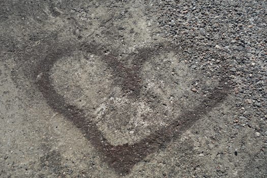 Heart mark in cement seen at a public swimming area