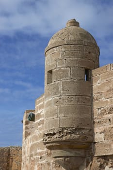 Fortified tower guarding the historic fishing port of Essaouira in Morocco.