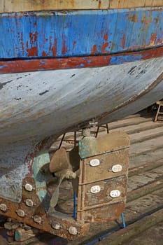 The rudder of a large fishing boat on a slipway in the historic harbour of Essaouira in Morocco.