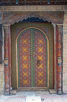 Traditional wooden door in the historic fishing port of Essaouira in Morocco.
