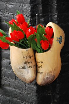 Amsterdam wooden clog shoes displayed outdoors.