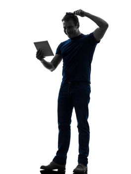 one caucasian man holding digital tablet brushing hair in silhouette on white background