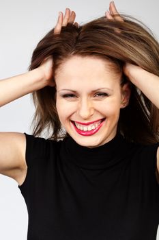 young and happy woman with raised hair