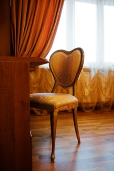 table and chair by the window in a modern apartment