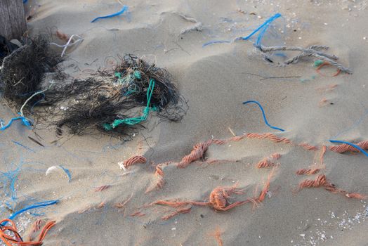 ropes and garbage pollution on the beach 