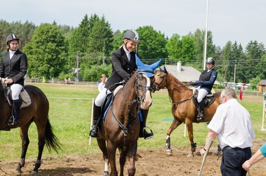 ANYKSCIAI, LITHUANIA - JUNE 01 : moment of horses jumping over fence match final awards on June 01, 2013 in Anyksciai.