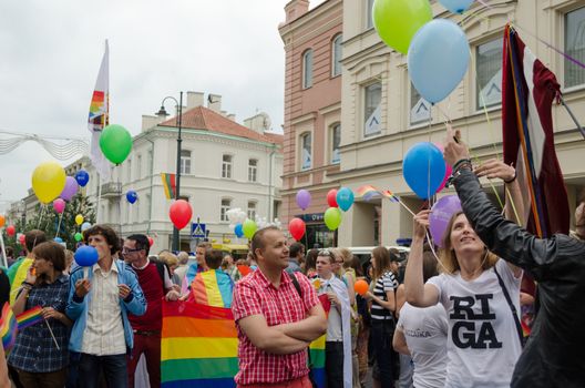 VILNIUS, LITHUANIA - JULY 27: Gay parade in preparation for the walk down the street the city center. Participants lined with flags banners with balloons on July 27, 2013 in Vilnius.