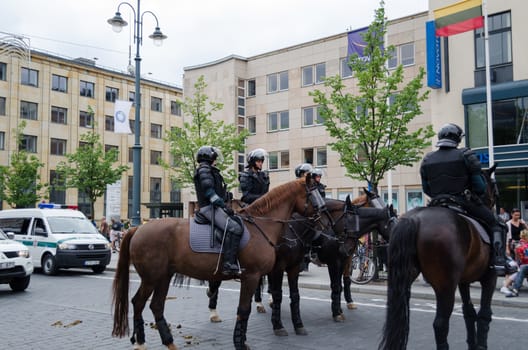 VILNIUS, LITHUANIA - JULY 27: police keep public event with strong riding horses on July 27, 2013 in VILNIUS, Lithuania. Mounted city police mobile force protection