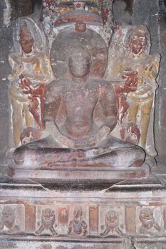 Religious images carved into solid rock inside an ancient Hindu cave temple, Ellora Caves near aurangabad, India.